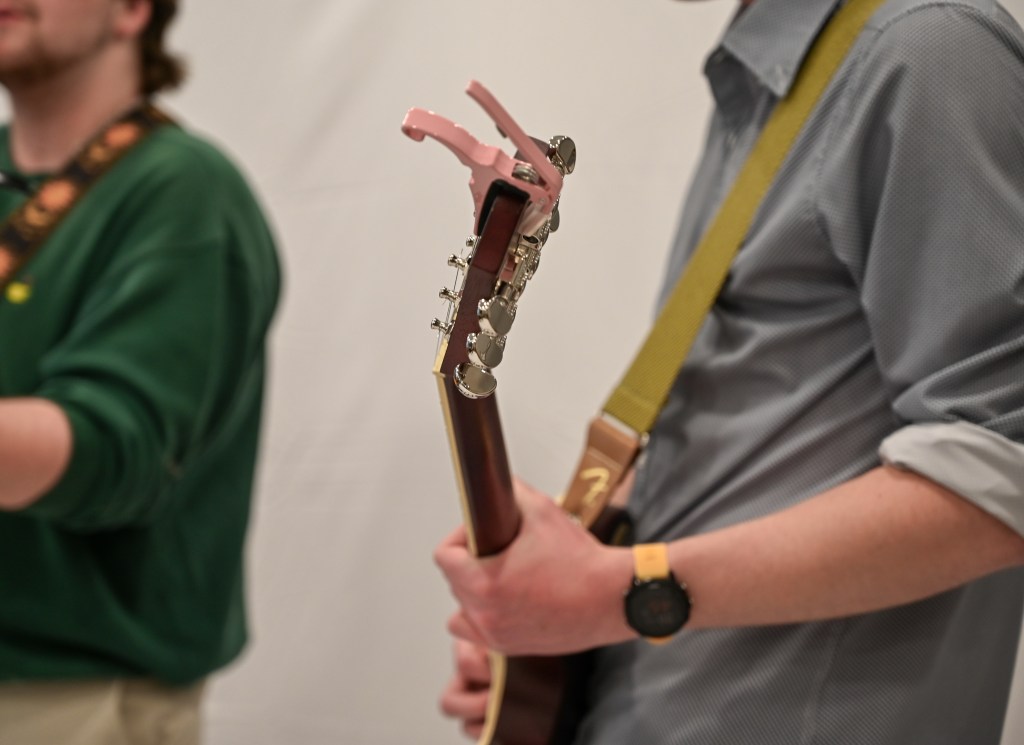Close up of a guitar being played